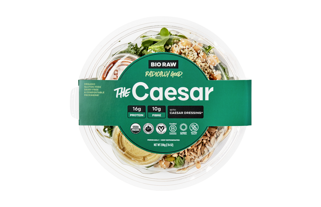 Packaged Caesar salad with label detailing ingredients and nutritional information.